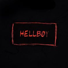 a black shirt with the word hellboy written on it