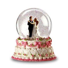 a snow globe with a bride and groom in it