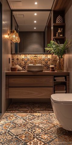 a bathroom with a toilet, sink and bathtub next to a wall mounted mirror