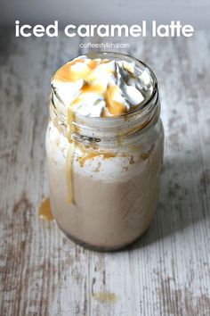 an iced caramel latte in a mason jar with whipped cream and toppings