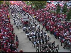 a large group of people are marching down the street