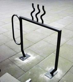 there are two metal bars on the sidewalk