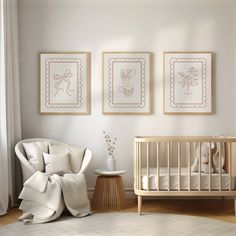 a baby's room with three framed pictures on the wall