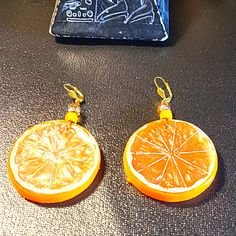 Orange Earrings - Orange Slices Earrings. Made With Tiny Rhinestones Circle Disk Along With Gold Tone Leaver Backs Ear Wires >>>>Hypoallergenic. Great To Wear With Casual Blue Jeans And Cute Top. Great Conversation Piece! Also Great For A Gift For That Special Someone! Not Heavy On The Ears. Very Light Weight On The Ear Lopes. 2 1/2 Inches In Length - -Width 2 1/2 Inches Light Weight. *** Comes With Great Free Goodie Thank-You Gifts Items. Orange Dangle Pierced Jewelry, Adjustable Orange Pierced Jewelry, Nickel Free Orange Drop Earrings, Nickel-free Orange Drop Earrings, Orange Hoop Earrings With Ear Wire For Gift, Orange Hoop Earrings With Ear Wire As Gift, Gift Orange Hoop Earrings With Ear Wire, Orange Earrings With Ear Wire For Gift, Nickel Free Orange Earrings For Gift