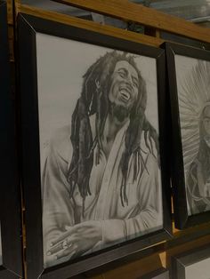 three framed pictures of bob marley hanging on a wall