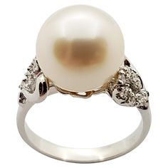 South Sea Pearl with Diamond 0.16 carat Ring set in 18 Karat White Gold Settings Width: 1.8 cm Length: 1.0 cm Ring Size: 52 Total Weight: 5.14 grams South Sea Pearl: 10.09 mm "We first opened doors in 1980 when it was then situated in the vicinity of the Victory Monument; a small and modest storefront with a couple of counters. From its humble beginnings to where it stands today, our company has proven its abilities as a jeweler. Since the beginning, we have been supplying fine quality pieces to dealers, wholesalers and customers worldwide. From then till now, our business still interrelates its name with quality products and excellent service, where commitment and sincerity toward customers will always be its motto." Pearl And Diamond Ring, Diamond Ring Settings, South Seas, Sea Pearls, South Sea Pearls, Pearl Diamond, Solitaire Ring, Ring Sets, Monument