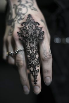 Intricate black tattoo covering the entire middle finger and part of the hand, featuring ornate designs. Hand To Forearm Tattoo, Black Finger Tattoo, Goth Tattoo Sleeve, Hand Tats Men, Henna Back Tattoo, Most Unique Tattoos, Henry Tattoo, Finger Tattoos Ideas, Dark Tattoo Ideas