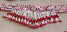 "Handmade white and red seed bead choker. The 8 1/4\" beaded strip has a diamond pattern design. The center is 2\" wide and the ends are 3/4\" wide. Red suede finishes the ends. Total length is 9 1/2\". White suede finishes the back nicely. The ties are 8\" long. Convenient to tie the necklace to the desired length. Like new condition. Does not appear to have ever been worn. Shipped by US first class mail. BDS-8" Red Bead Choker, Gift Red Handwoven Beaded Necklaces, Red Hand-strung Beaded Necklace, Red Multi-strand Beaded Necklace, Red Southwestern Hand-strung Beaded Necklaces, Black Onyx Ring, Red Suede, Onyx Ring, Ring Fit