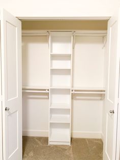 an empty walk in closet with white shelves and doors open to reveal another room that has carpet on the floor