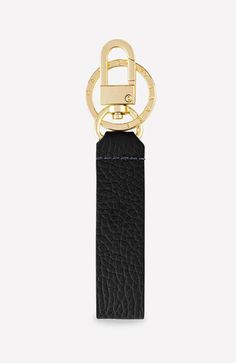 a black leather key fobring with a gold metal ring on the top and bottom