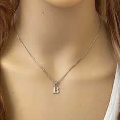 Description: 925 Sterling Silver Mini Small Initial Letter B Pendant Necklace Item No.: H89.Q Metal Type: 925 Sterling Silver (Available In 10k And 14k Gold) Metal Color: Silver Height With Bale: 15 Mm Width: 4.8 Mm Italian Rolo Chain In 16", 18", 20", Available In Another Listings In Any Letter A-Z Made To Order. Please Allow 10-15 Days To Be Shipped. Silver Dainty Initial Necklace For Formal Occasion, Silver Initial Necklace For Everyday Wear, Classic Silver Initial Necklace For Formal Occasions, Silver Formal Initial Necklace, Sterling Silver White Gold Initial Necklace, Classic Silver Initial Necklace For Anniversary, Classic Silver Initial Necklace, Classic Silver Engraved Initial Necklace, Sterling Silver Hallmarked Initial Necklace