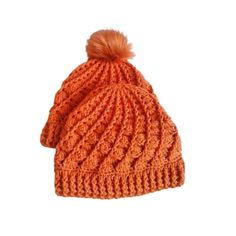 an orange knitted hat with a pom - pom on the top and bottom