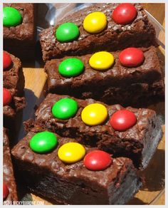 chocolate brownies with m & m candies on top are ready to be eaten