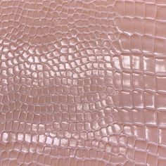 a close up view of the skin of an alligator - embossed leather material