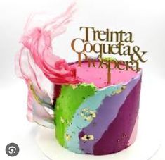 a multicolored cake with the words'trena coquetas & happens'on it