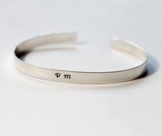 This sterling silver open cuff is 6 cm wide and 0.8 mm thick. Flexible, light and comfortable but won't lose its shape. Easy to match with others and simple to go with any outfit. You can choose to have this bracelet 16 cm, 18 cm or 20 cm long. However if you want a different size please contact me. **You can write anything on the bracelet either on the inside or the outside. Please let me know in the personalisation instructions! Each cuff is handmade to order and may slightly vary from the pic Sterling Silver Open Cuff Bangle For Gift, Sterling Silver Open Cuff Bangle As A Gift, Minimalist Sterling Silver Cuff Bracelet Gift, Minimalist Sterling Silver Open Cuff Bracelet, Minimalist Sterling Silver Cuff Bracelet, Minimalist Engraved Bangle Cuff Bracelet, Minimalist Personalized Bangle Cuff Bracelet, Personalized Minimalist Bangle Cuff Bracelet, Minimalist Silver Cuff Bracelet With Hand Stamped Details