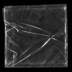 a black and white photo of a piece of plastic