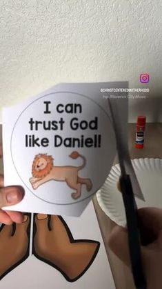 someone holding up a sticker that says, i can trust god like daniel