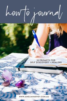 a woman sitting at a table writing on a book with the title how to journal