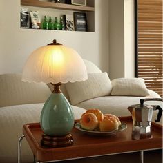 a table with some food on it and a lamp