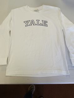 These are long sleeve white Yale shirts for kids, we have multiple youth sizes available. Check us out on Facebook at Heck's Things and Things. Youth Shirt, White Long Sleeve, Berlin, Gender Neutral, For Kids, Adult Outfits, Tops & Tees, Top Outfits, T Shirts