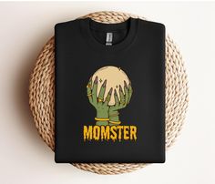 Get ready to embrace your inner "Momster" this Halloween with our playful Momster Sweatshirt! Perfect for festive gatherings, school events, or cozy nights in, this fun and comfortable sweatshirt is a must-have for every mom who loves to celebrate the spooky season with a dash of humor. Key Features:     - Whimsical Design: Featuring a cheeky "Momster" graphic, this sweatshirt adds a fun twist to your Halloween wardrobe. It's a perfect way to showcase your playful side!     - Ultimate Comfort: M Momster Sweatshirt, Halloween Moms, Dog Mom Sweatshirt, School Events, Whimsical Design, Halloween Looks, Comfy Sweatshirt, Mom Sweatshirt, Fete Halloween