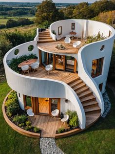 an aerial view of a circular house with stairs