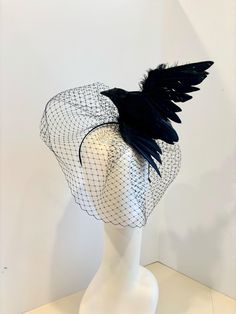 The Birds- Black Bird veiled Fascinator- Feather Headband- Halloween - Crow- Derby- Ravens - Goth- Steampunk Hello, This fascinator comes with or without a veil It is perfect to add whimsey and is just so fun you'll be the life of the party.  A great conversation piece.       This black feather fascinator has a black bird with wings.  It's not a real bird, its plastic covered with feathers and very light. Plain Crow $60. With a large Black veil. $98. It is about 5" and wings are made of feathers Bird Headband, Goth Steampunk, Raven Bird, Black Fascinator, Feather Fascinator, Feather Fascinators, Feather Headband, Black Veil, Costume Hats