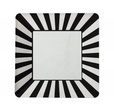 a square red and white plate on a white background with sunbursts in the center