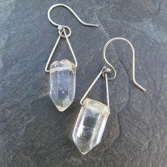 Healing Quartz Crystal Dangling Earrings Clear Gemstone Drops: These rectangle hoop earrings are hand made out of hammered sterling silver and natural polished clear Quartz crystal points. They measure about 2" total length by approximately 1/2" wide. 100% hand made by myself in my little home studio. You will receive a pair similar to the pair pictured. Enter my shop: https://www.etsy.com/shop/artdi Join me on Facebook: https://www.facebook.com/Artdi-Diana-Anton-Jewelry-Design-44805607932/ Find Minimalist Sterling Silver Crystal Earrings For Everyday, Everyday Minimalist Sterling Silver Crystal Earrings, Minimalist Silver Nickel-free Crystal Earrings, Modern Sterling Silver Dangle Crystal Earrings, Nickel Free Clear Minimalist Earrings, Silver Crystal Earrings With Ear Wire For Everyday, Nickel-free Clear Minimalist Earrings, Nickel-free Minimalist Clear Earrings, Silver Nickel-free Crystal Earrings For Everyday