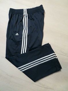 For your consideration is a great looking pair of Adidas men's athletic - lounging pants in a size Large. The pants are preowned in excellent condition with no defects. The pictures are of the actual item you will receive. The material is 100% polyester and is machine washable. The color is black with three white stripes. The pants feature an elastic waist with a drawstring and 2 side pockets. The pants are 42" in total length and the inseam is 29" with a 11" leg opening. I accept Adidas Relaxed Fit Jogging Bottoms, Casual Jogging Pants With Three Stripes, Cotton Relaxed Fit Pants With Adidas Logo, Relaxed Fit Sportswear Bottoms With Three Stripes, Relaxed Cotton Adidas Pants, Adidas Athleisure Pants With Logo, Adidas Moisture-wicking Sweatpants For Jogging, Adidas Logo Pants With Relaxed Fit For Jogging, Adidas Relaxed Fit Jogging Pants