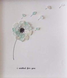 a white plate with a dandelion on it that says i wish for you