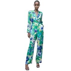 Zara Floral Print Long Sleeved Multicolored Jumpsuit. Size Xs. New & Unworn With Tags. Lapel Collar Surplice V-Neckline Long Sleeves Shoulder Pads Straight Leg Front Zip And Golden Button Closure Side Slant Pockets 100% Polyester. Measures: Armpit To Armpit - 18” Waist - 13” Rise - 11.5” Inseam - 30” Length - 57.5” Leg Opening -9.25��”. Chic Green Floral Print Sets, Fitted Green Pantsuit For Summer, Spring Green Fitted Pantsuit, Chic Green Summer Pantsuit, Zara Green V-neck Jumpsuits And Rompers, Chic Green Pantsuit For Spring, Floral Print Jumpsuits And Rompers For Spring Workwear, Spring Green Pantsuit, Casual Green Pantsuit For Spring