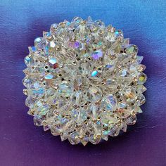 "This dazzling restored silver tone vintage AB beaded circle brooch was found in a lot of estate jewelry.  The brooch is 2.5\" across. All  of the AB bicone bead and rhinestone end pins are original and in very good condition. The beads are wired to the metal setting.   The brooch is unsigned.  The pin mechanism is in good working order.   This is a statement piece with sparkle and fire flashes which will dress up any lapel or hat!" Party Costume Jewelry Brooches, Round Crystal Brooch For Party, Crystal Round Brooch For Party, Old Fashion Christmas Tree, Beaded Circle, Old Jewelry Crafts, Vintage Texture, Retro Jewelry, Crystal Brooch