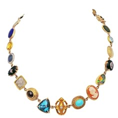 One-of-a-kind, Bohemian necklace features multiple gemstones, vintage jewelry pieces and ancient coins set in 14k yellow gold. Amazing 23 pieces include: blue Topaz, Australian Opal, Diamonds, Lapis Lazuli, Citrine, Onyx, Garnet, Turquoise, Cat's eye honey Quartz, vintage Shell Cameo, ancient Arabic coin, and ancient bronze coin. Each piece on its own is uniquely beautiful, but all together, they come together to form a symphony of eclectic colors, styles and stories. Vintage Italian Jewelry, Italian Jewelry Designers, Ancient Coin Pendant, Multi Gemstone Necklace, Antique Jewellery Designs, Crystal Statement Necklace, Ancient Coin, Cookie Cups, Detailed Jewelry