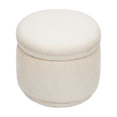 a white round ottoman sitting on top of a floor