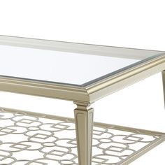 a silver coffee table with glass top and metal frame around the bottom, on a white background