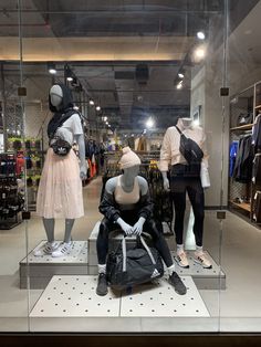 the mannequins are dressed in all black and white