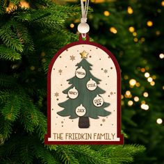 a wooden ornament hanging from a christmas tree with the words, the friedkin family