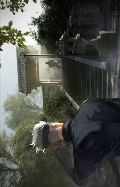 a man with white hair and black shirt holding a nintendo wii game controller in his hand