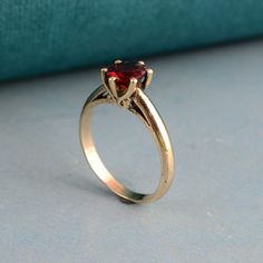 Garnet Solitaire Ring, Diamond Cut Ring, Red Garnet Handmade Ring, Minimalist Ring, Gold Filled Garnet Ring, Gift For Her, Wedding Gift Ring Welcome to My shop We provide the Excellent quality Jewelry to our Customers. Customer satisfaction is our first priority Handmade Items PRODUCT:- Ring Material:- Brass ♥ We have brass and 925 sterling silver rings in all size for both men and women. ♥ We always use precious and semi precious gemstone for making jewelry.If you have any design in your mind s Classic Red Promise Ring, Classic Red Birthstone Ring, Classic Red Rings For Valentine's Day, Red Solitaire Rings As Gift, Red Solitaire Ring For Promise, Red Solitaire Birthstone Ring, Red Solitaire Birthstone Promise Ring, Red Solitaire Promise Ring, Red Solitaire Birthstone Ring With Round Band