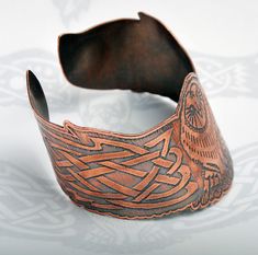 Celtic owl cuff - Viking owl cuff - celtic bracelet - copper bangle - Norse cuff - celtic knotwork - barn owl, pagan band - shamanic jewellery This beautiful Celtic owl cuff is made from solid copper and is completely handmade by me in my studio workshop. The original design is hand drawn by myself, first designing the outer shape of the owl and then carefully planning the celtic knotwork in the wings to fit sympathetically to the shape. Once I have completed the hand drawn design, I then digiti Medieval Handmade Cuff Bracelet As A Gift, Handmade Medieval Cuff Bracelet As Gift, Viking Style Handmade Bracelets As Gift, Handmade Medieval Cuff Bracelet For Gifting, Handmade Viking Style Bracelets For Gifts, Shamanic Jewellery, Viking Cuff Bracelet, Fenrir Bracelet, Dragon Cuff Bracelet