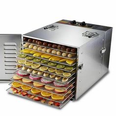 a food dehydrator with trays full of fresh fruit and pastries