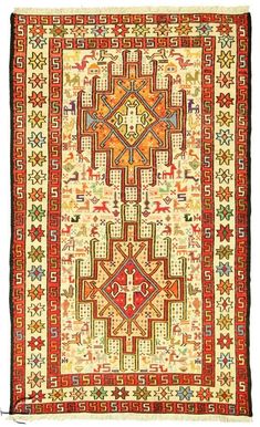 an old rug with many different colors and designs on the sides, including red, yellow, green, orange, and white