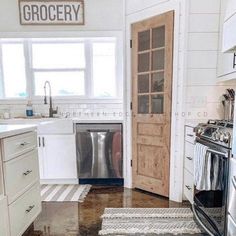 a kitchen with an oven, dishwasher and stove in it's center