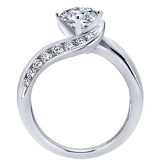 a white gold engagement ring with diamonds on the side