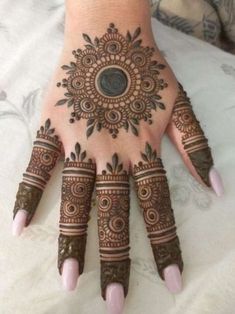 henna tattoo on the palm of a woman's hand