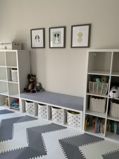 a room that has some bookshelves and toys in it