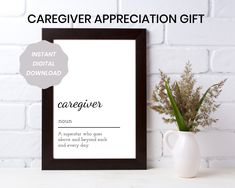 a white vase sitting next to a black and white framed sign that says caregiver appreciation gift