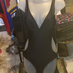 a mannequin wearing a black and white swimsuit